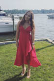 I wore this dress to a wedding and got tons of compliments. The color is beautiful and the dress looks great on. It was definitely a bit confusing to tie though and the strings kept getting uneven. I also felt like it was a bit revealing on top and I had to readjust so I wouldn't pop out every two minutes. - Jaclyn L.