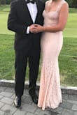 Absolutely love this dress! I wore it to a summer black tie wedding. So comfortable and looks beautiful in pictures. Stretchy material for comfort over a long wear. Long dress so plan to wear heels. I have a small chest so I was able to wear sticky boobs for added cleavage but if you have a larger chest you may feel the top is tight. Totally worth the buy! - Daniela C.