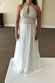 This dress is absolutely stunning. It hit my waist in just the right spot and made me look really thin. I would have chose it for my beach wedding dress, but unfortunately the part around my neck irritated me and I was worried I would be uncomfortable. This has nothing to do with the dress, just a personal preference because I don't usually like things tight around my neck (i.e. turtlenecks; I feel claustrophobic). Other than that 10/10 would recommend. - Kyla K.