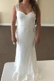 This dress was in the running for my beach ceremony dress and was gorgeous. I just chose to go with another dress. The fit was very flattering and not too tight to the body. Would look great with a bridal belt. Would recommend if you are looking for something comfortable and casual, but still bridal and beautiful. - Kyla K.
