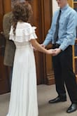 I loved this dress the moment I saw it in the picture! When I tried it on I was unaware the it was like putting on a robe and you have to tie everything.....I'm still not sure how it's suppose to be worn. The dress is still very beautiful however, I wore it when I got married in the courthouse. - Emily W.