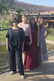 I wore it to a friend's wedding and it was gorgeous. The only thing I had to do was get it hemmed because it is large in that department and I am also not that tall, 5'4". That's that I was wearing 3 inch heels too! It's definitely not see through. It's lined with, what I think is, silk underneath and it also has two layers on top of that of a different material. - Jessica G.