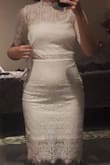 I'm 5'2, very small on top with wide hips. I'm usually a 26/27 in jeans and an xs in tops. I purchased an XS. This dress was so beautiful and well made. However, the chest area fit loose and the bottom fit tightly on my hips. It has almost no stretch, which enhances the quality and look of the lace, but because of the tightness in my hips, it kept riding up making the top even baggier. Such a shame, because it's soooo nice otherwise! 4 stars only because it didn't fit me. Returned. - Jannine M.