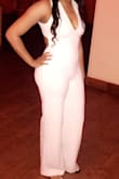 It was true to size no need for a bra. I thought it was going to be baggy in the back but it was a great fit perfect stretch. I had heels on the whole night this photo was taken without but it still wasn't dragging to much. - Nicole N.