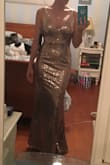 I bought this dress because I am a singer and need a beautiful dress to wear during my performance. This dress is just perfect--it is simple in it's cut, yet obviously showy with the gold sequins. It is the perfect amount of modest and seductive. I am so excited to wear this during my show, and I already know it is going to be a HUGE hit. - Courtney R.