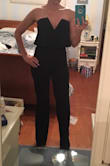 Oh my gosh...I can't express how much I love this jumpsuit. It was a little showy, with the super-deep V (and since I'm large-chested), but still very beautiful. The torso was a little long, so the zipper bunched in the back (I also have a very curved back; small torso and large bottom), but the top flowy over-hang of material covered it up. The pants were long, yes, but they fit with my 5 heel inches. If I had, however, pulled the zipper straight and elongated the torso fabric, they pants definitely would have dragged and my crotch would have been hanging. Aside form all of that, I still love this jumpsuit. - Courtney R.