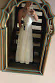 This dress is gorgeous! If you're a little on the shorter side like I am you're probably going to have to get it hemmed or wear some platforms with it. I also have a very small waist so the dress was a lot larger around that section than I would've hoped for. You can see in the picture I just knotted the ties around to the front to cinch it in more which worked perfectly for me. - Julie K.