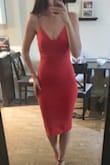 This is a great dress. I got a ton of compliments on it. It is a little stretchy, runs tight and true to size but if you are on the larger end of any size, size up. I will be buying this in other colours. - Emma S.