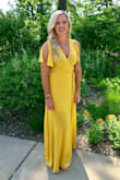 I absolutely love this dress. I wore it to my cousin's wedding this summer and I received so many compliments on it and the golden yellow color. It looked perfect with a tan and red lips! 10/10 definitely recommend! - Amanda J.