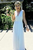 This dress was stunning on. I wore it for my garden wedding and it was perfect. Though it was slightly big in the chest area for me and a bit tight in the waist. The length was great for a wedding dress (hit the ground slightly, I'm 5'10'') and it flowed beautifully. The slit in the leg was perfect for walking around and added a little bit of 'sexy' to the dress. The open back was gorgeous. Great price, too! Highly recommend. - Brooke T.