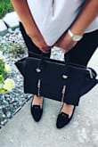 Such a cute purse. A little stiff but that's what makes it stand up. I like a purse that keeps its shape. Will probably wear it forever. Works for business and casual wear. - Sanela K.