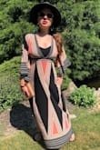 I LOVE this dress!! So far I have worn it to the Riviera Maya, a festival, and a garden brunch party. It's soft and flows nicely when you walk plus the material is thin so you can wear it on a hot day. It does have a deep plunging neckline which was great while clubbing in Mexico however for a more modest event you can wear a cotton bralette like I am in the pic. - Lisa S.