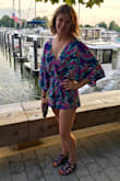 I waited a long time to pull the trigger on this romper and I wish I had done it sooner. It's my first-ever romper and it's fabulous. It's definitely short, but the flowy top balances everything out. Got lots of compliments when I wore it and can't wait to rock it again! - Maggie D.