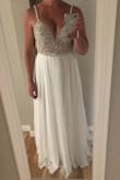 I bought this dress for my November wedding, and couldn't be more excited!! The beading is gorgeous and excellent quality. I love how the skirt sits higher up on the waist and how it doesn't hug my tummy and hip area. When I tried it on for my mom, she said it looks like something we would've purchased at Kleinfeld's. Can't wait to see my grooms reaction on our wedding day! - Molly K.