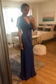 I sized down to a XS (normally S), for the wrap detail to not overlap and hem to fall correctly. It was perfect! Fabric is very sheer and wrinkles easily but the darker color helps it not be see through and wrinkles come out easily with a steamer. Glad I caught this on sale! - Danielle S.