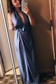I ordered this dress for a July wedding and it was overall a nice choice. It is light and comfortable, although was a little confusing to get on a first since it is a wrap dress. Therefore it was adjustable so I wish that I got an xsmall instead of a small. It gets extremely wrinkly (which was a little tough to travel with) and it does go down very low so I had to pin the middle. But overall I loved the color of the dress and it was a nice fit. - Katrina P.