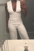 I have long legs and a curvy bottom half.  This jumpsuit is long enough for me to wear heels and fits almost perfect!  I am tempted to order more colors!  I usually wear a size 8 or 10 in pants and have to have a long inseam.  You won't regret this purchase. - Tiffany S.