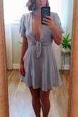 The light blue is a very light blue/grey pastel. It's a little "chest-y" for my taste but it's cute for summer with the boyfriend. Definitely need some fashion tape! Small fit perfectly and comfortably. - Rebecca T.