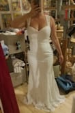 Bought this as my reception dress (my wedding dress is a lot bigger and wouldn't be comfortable to wear all night)...this dress is perfect...very comfy and still flattering. And I can still wear a bra in this style to hold up the girls! I'm pretty curvy but still very petite and I am wearing 2.5 inch wedges under this dress. Will need to hem but it's a great purchase. - Jessica B.