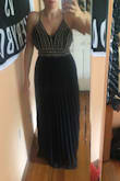 Gorgeous dress! Great quality! I would highly suggest for any formal event. Please excuse the messing room in the picture. I went with a large because of being a 34DDD and height. This picture is with a strapless bra and no shoes. - Nicole B.