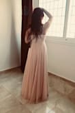 The dress fits true to size. I really liked wearing it. The length is perfect. - Samar B.