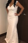 This was the 3rd dress I ordered during my search for the perfect dress.  I chose this dress for my Vegas wedding and it gave me the exact look I was going for...classic, elegant, beautiful & sexy.  I probably would have been a Large, but only the XL was in stock.  It ended up fitting just fine.  A little loose in some spots but I was comfortable. - Alexis P.