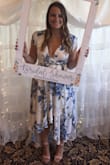 I ordered this dress last minute when a few other dresses for my shower didn't work out. I originally ordered it in a large, however was accidentally shipped a medium. Since it was two days before my shower, I didn't have any other options but lucked out that the medium actually fit! It was perfect for my shower since one of the main colors was blue! I received so many compliments and felt amazing in it!! I cannot wait to wear this dress again!! My one recommendation for those smaller chested would be to get some boob tape, as it is a little larger on top and opens up when you sit! - Afroditi S.