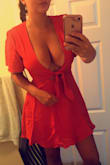 This dress is so cute! It fits perfectly, however I do have larger boobs and wow they are out there in this! I tied the front as tight as possible. I'm wearing this to the red dress run in New Orleans so it's perfect. I don't mind that it's a little revealing, but if you're someone who's self conscious about that this isn't the dress for you. - Amber P.