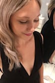 The dress fits well. The material is very flowy and has a nice texture. The dress comes a little low in the chest area but it is not unflattering. I love the open back, the low cut of the sides and the subtle slit down one side of the dress. - Stephanie K.