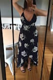 I returned this as I felt it was a little small for me I felt I was popping out of it a bit much for my comfort. And because it flares a bit I felt it was too wide, I didn't feel it was flattering on me. However the dress in person is beautiful and quality was great. - Shauna B.