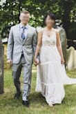 I LOVE this dress. It was my wedding dress for a casual back yard wedding. In typical lulus fashion, the dress is very long so I was able to tailor the front to my height (wearing flats) and keep the longer length in the back for sort of a train (see pic). I also tailored the top to fit better as I have pretty narrow shoulders. The top has lovely embroidering and the bottom has some really simple and soft lace over a light pink/lavender lining. The style of the dress fit my personality so well and had all of the points I wanted in a wedding dress (not white, embroidering, lace over color, and bit bohemian) and I was so happy to have found it. I've tried so many Lulus dresses (probably around 20) and most of them seem to be made of a thick polyester, but occasionally there are thinner polyester that feels more delicate and not so costume dressy and this dress of one of them. The dress is light and airy and was very comfortable for an outdoor wedding in the low 80's. If you are looking for a really lovely dress that will make you feel so pretty, this is the one for you. Highly recommended! - Thuhien N.