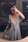 This dress is the perfect spring/summer dress, I ordered a small and it fits perfectly. It's just the right length for my height and while the v-neck is rather low, it shows just the right amount of skin and isn't too overbearing. Can't wait to wear this out! - Julia P.
