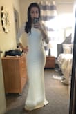 Very surprised by this dress, I'm usually a bit nervous about backless dresses because no matter what I totally get those rolls on the side. This dress is very nicely structured.

The back only shows the most flattering part and it has nice boning to keep it in place

Got this for my bridal shower and haven't got to spend all day on it yet, but felt so elegant just trying it on. Must buy! - Marissa B.