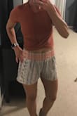 The material feels really nice against your skin. It does show a lot of your belly just a heads up. I didn't think it was going to show that much but it does. I love the color too! - Gina S.