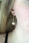 These earrings are super cute, and a steal on clearance! Other reviews mentioned that the stars and/or the moons sometimes face the wrong way, but I fix jewelry, and it was simple enough to just use some pliers and turn the stars/moons around. They're very lightweight, but look classy, and I've gotten tons of compliments on them already. Would buy again. - Emma W.