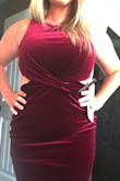 I cannot wait to wear this. I wanted it to be a little loose. I usually wear a Large in dresses but ordered up because I wasn't sure how forgiving velvet would be on my curves. I have extra weight in my stomach right now (post baby) but it still was flattering still. Lighting in the first picture is too bright. The 2nd picture shows the true color. - Brittany E.