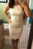 I love this dress! I ordered the white dress and I was nervous about it being see through. The fabric is really nice and thick though, so the dress isn't see through at all! It came down to just above my knees. Definitely can't wear a normal bra with it but a sticky bra would work if you feel like you need one! The only complaint I would have is that because there are 2 layers to this dress, it has a tendency to wrinkle underneath so I had to repeatedly adjust the dress. That being said, it was worth it because I love how the dress looks! - Natalie S.