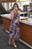 This dress is very beautiful, and was perfect to wear as a wedding guest. I ordered a S but was sent an XS, and it barely zipped up. There is no give to the fabric, so I recommend sizing up then getting it tailored to your specific measurements. - Beth W.