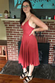 I love this dress, it is so flowy and cute and comfortable. The size chart said I would be a large but I had already ordered a medium. The medium ended up fitting really well, but there is room for adjustment with the tie in the back. I had to get the dress dry cleaned because it was very wrinkly when it came out of the packaging but I am not at all disappointed with this purchase! - Leah B.
