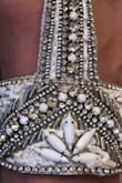I love them. The are beautiful and great quality. The bead work is done great, doesn't look like cheap crystals and I believe it's real leather. They are a tiny bit small but I would highly recommend buying them if they catch your eye. - Danielle P.