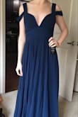 It's so beautiful and the material is definitely not cheap looking (a fear I had when I saw the price). I wanted something navy for my winter wedding and this is perfect! I plan on having it hemmed. - Sunny L.