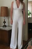 High quality jumpsuit! I normally wear a medium but I wanted to wear this for graduation so was looking for a look that wasn't too snug. I sized up to the large and was happy with the choice. The jumpsuit was just a touch large under my chest and above the butt (i.e., lower back area). I think the medium would have fit perfect for a night out but the large was great for graduation. - Chris L.