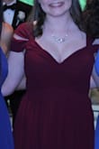 The dress was amazing, I wore this to my junior prom. It was perfect for my body. it fit at the top and then flaired and went straight around the waist. The only thing is that if you have large boobs, i would be careful when ordering, i should have ordered a M with my 32DD but a S was fine just a lot of cleavage was showing. - Sydney