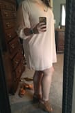 I'm usually a L and wanted to err on the larger side to make sure it was long enough so I sized up - so glad I did! Cute dress with good fabric that's easy to dress up or down. Hides the tummy area well which is desirable sometimes but conversely it lacks any shape and can end up feeling like I'm wearing a nude pillow case. - Ginger P.