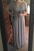 Not the highest quality material (couldn't find the tag when writing this review but pretty sure its +95% rayon = nubbies over time) but wow there's a lot of it! This dress has some real weight to it - the length is perfectly hovering above the floor without dragging if I wear a heel with it. The top half is just two super long pieces of fabric...I'm kind of in love - there are so many ways to tie the top and appreciate that your website includes options! The color is such a nice cool toned neutral that I foresee this dress having many more uses in the future beyond the fall wedding I bought it for. I have a taupe colored bra on from true&co and it's the exact same color - huge bonus!! - Ginger P.