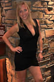 Great fabric that hugs your body well! Sexy low cut front but still able to wear a strapless bra if you wish. The bottom of the dress rides up a bit while walking but that didn't bother me too bad. Cute dress! - Laura O.