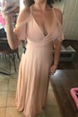 The dress itself is beautiful. The only issue is that I am busty and my boobs are all out to be seen in this dress. I'd recommend for a smaller chest woman. Also, because it is a tie dress, it can be tapered to really any size. It was larger than what my normal size is so I had to return and reorder. That was a breeze! Customer service was great! Dress is gorgeous! - Katelyn D.
