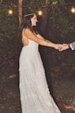 I wore this as my reception dress and received MULTIPLE compliments. You could never tell it wasn't a traditional expensive wedding dress. A gf of mine was gushing about how it was exactly the type of dress she wanted. Very boho, comfortable, and a night heavy material on the bottom. I had the front custom made into a little more of a sweetheart shape to match the rest of the pattern. You'll definitely need a sticky bra or no bra as well. It runs large (usually I buy Smalls but XS was perfect). I highly recommend this dress! Note that it's actually more of a cream color with a little ivory detail. - Kelly K.