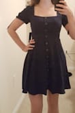 This dress is so cute! The length is perfect for my height 5'3 and is conservative enough to wear to the office or a business party. The material is thick and a beautiful Navy blue. The top is sewn shut, so you don't need to worry about the buttons popping open. I am able to wear the dress with a thin bra. The sleeves have no problem staying up as they are lined with sticky stuff...not sure what they call that in the fashion world =). The first time I put the dress on I did need someone else to zip it up for me. Once it stretched a little after the first 2 wears, I was able to zip it up myself pretty easily. It's hand wash only also which I recommend doing since this is a very nice dress! - Marissa V.