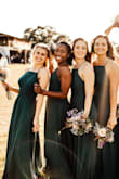 This dress is beautiful. It is darker than the photo, almost more of a dark dark green than a forest green. It isn't quite as low cut on the side so no need to worry about side boob, also the straps are adjustable which is great. A universally flattering cut, great for a bridal party. - Jordan P.